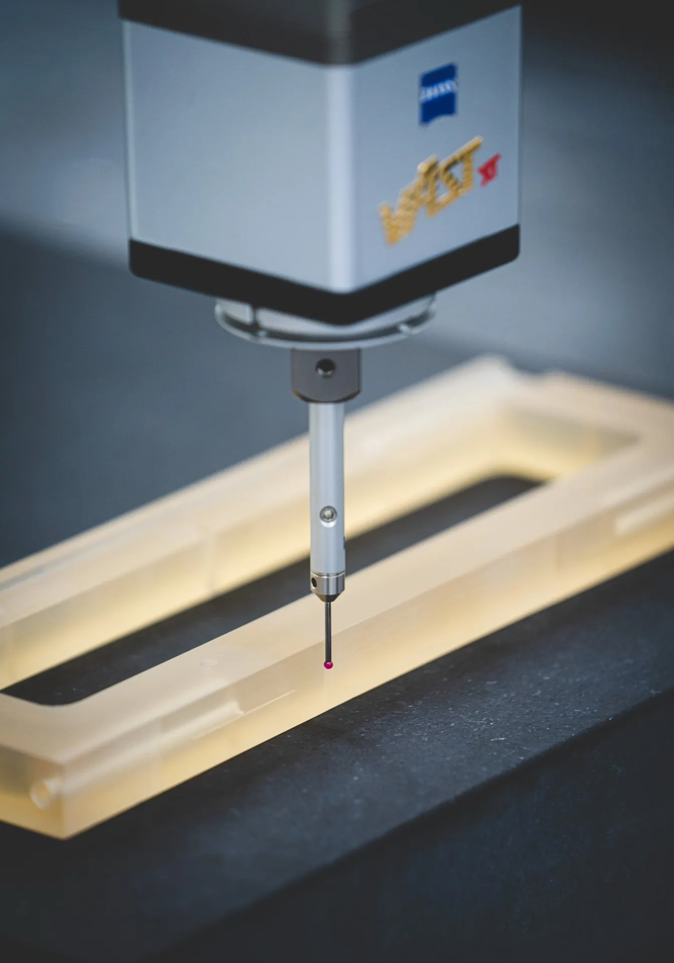 Probe on a Zeiss coordinate measuring machine touching a glass-ceramic frame