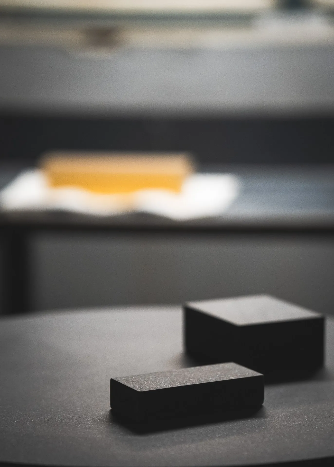 Two black diabase blocks on a surface plate in the workshop